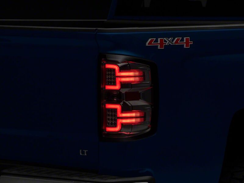 Raxiom 14-18 Chevrolet Silverado 1500 LED Tail Lights/SeqTurn Signals- Chrome- Smoked Lens