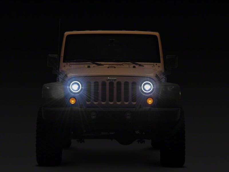 Raxiom 07-18 Jeep Wrangler JK 7-Inch V2 Dragon Eye LED Headlights- Black Housing- Clear Lens