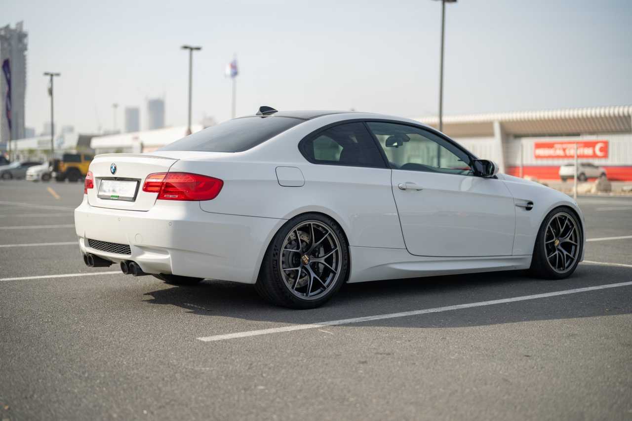 White tuned BMW M3 E92 coupe – side view | ATOMIC-SHOP