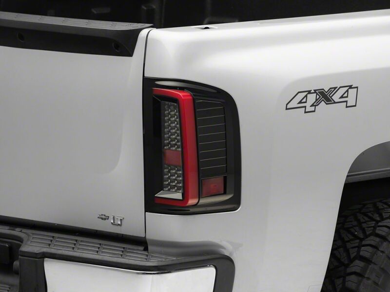 Raxiom 07-13 Chevrolet Silverado 1500 G2 LED Tail Lights- Black Housing- Smoked Lens