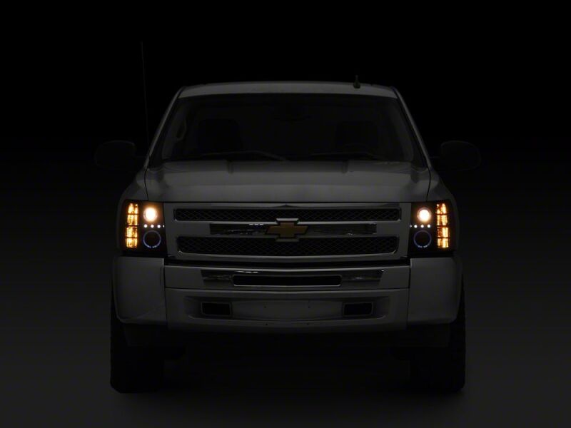 Raxiom 07-13 Chevrolet Silverado 1500 LED Halo Projector Headlights- Black Housing- Clear Lens